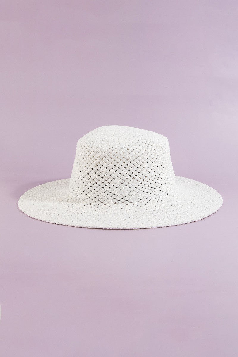 White straw hat on a light purple background