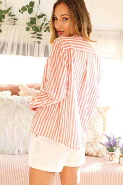 woman wearing striped button up with jeans 