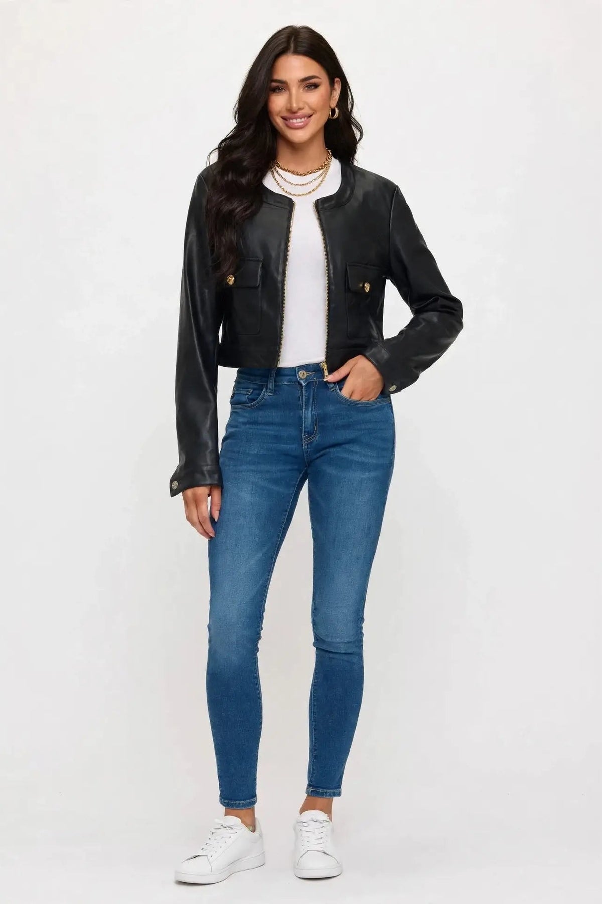 woman in cropped leather jacket and jeans