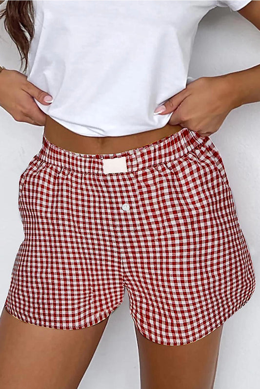 woman wearing gingham shorts and white top