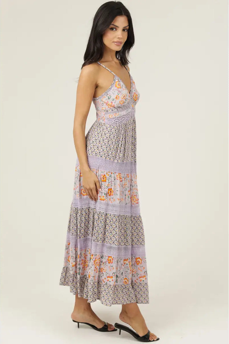 Woman wearing a floral patterned dress on a white background