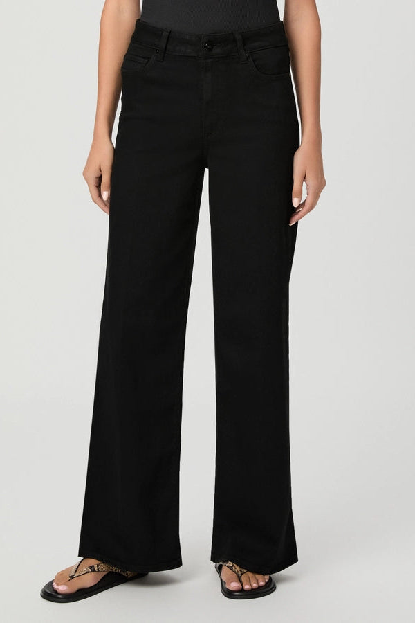 close up of person in black jeans
