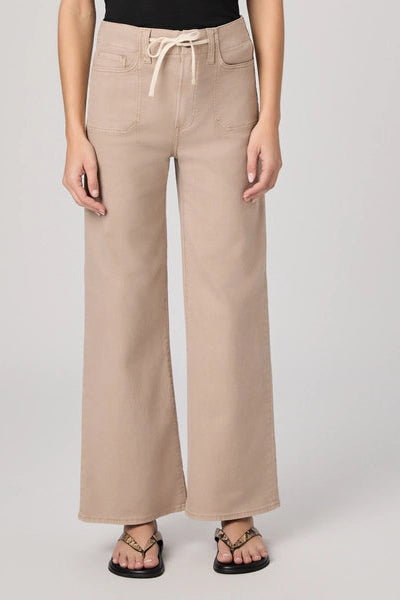 Beige wide-leg pants worn by a person on a plain background