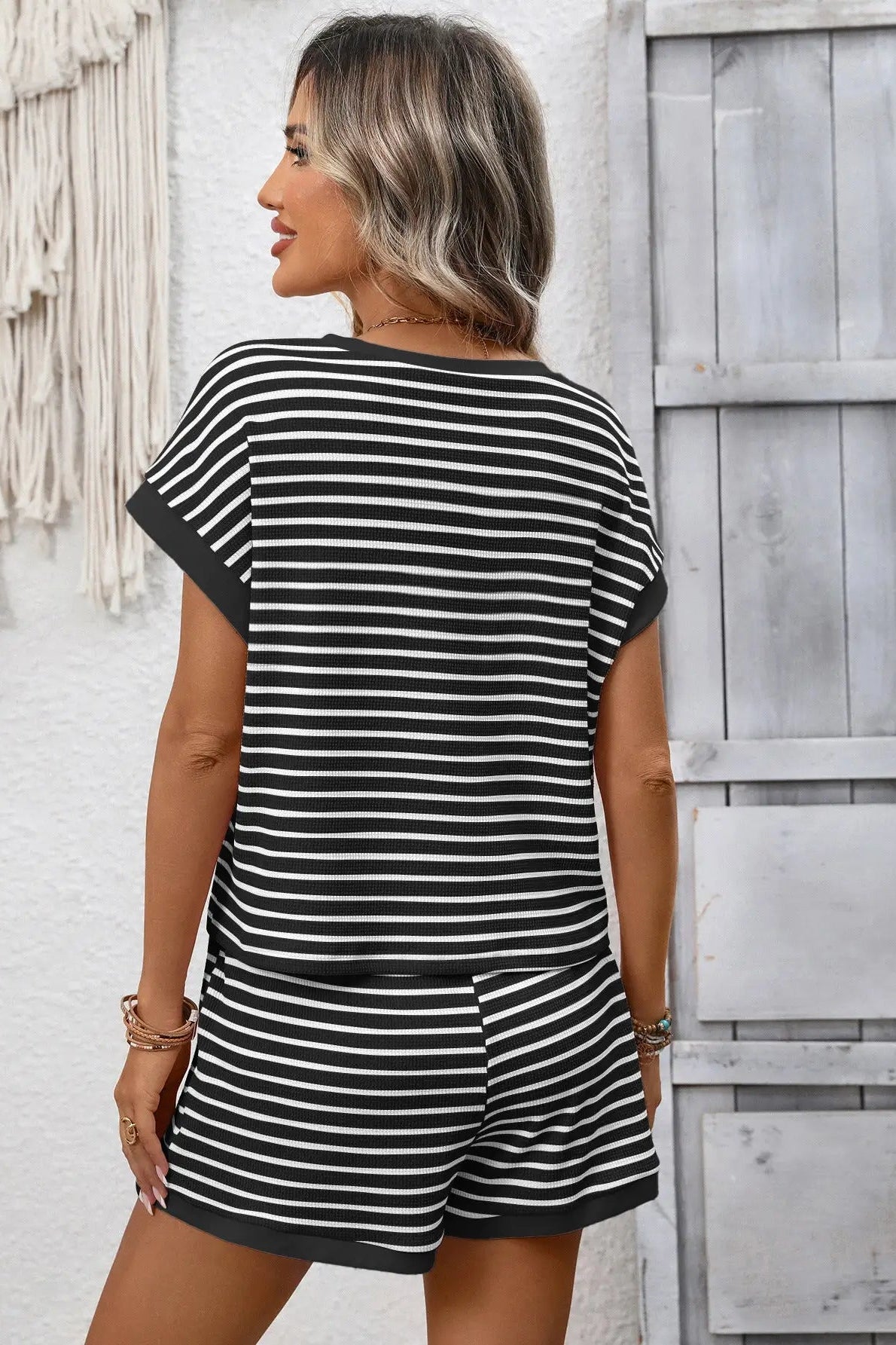 woman wearing matching stripe tee and shorts set 