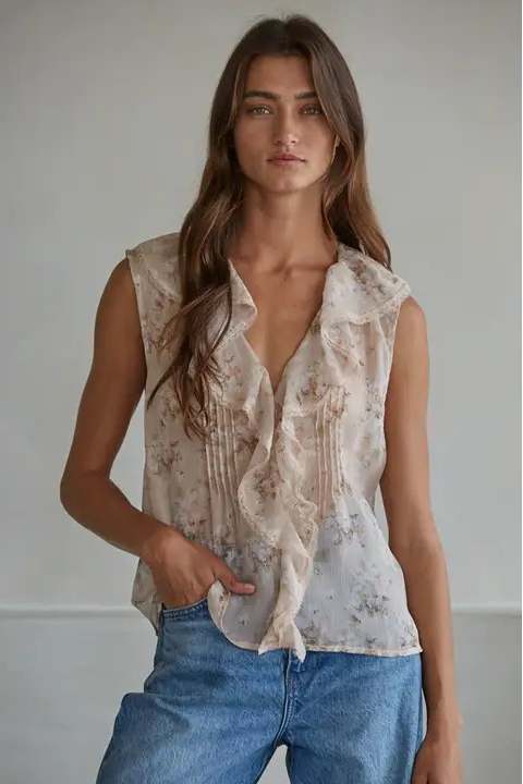 woman wearing floral ruffle blouse with jeans