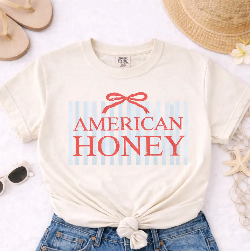 Beige t-shirt with 'American Honey' text on a white background