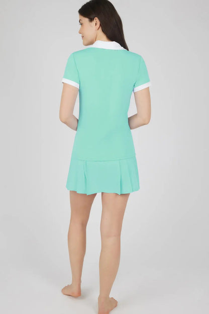 woman wearing matching polo top and skort