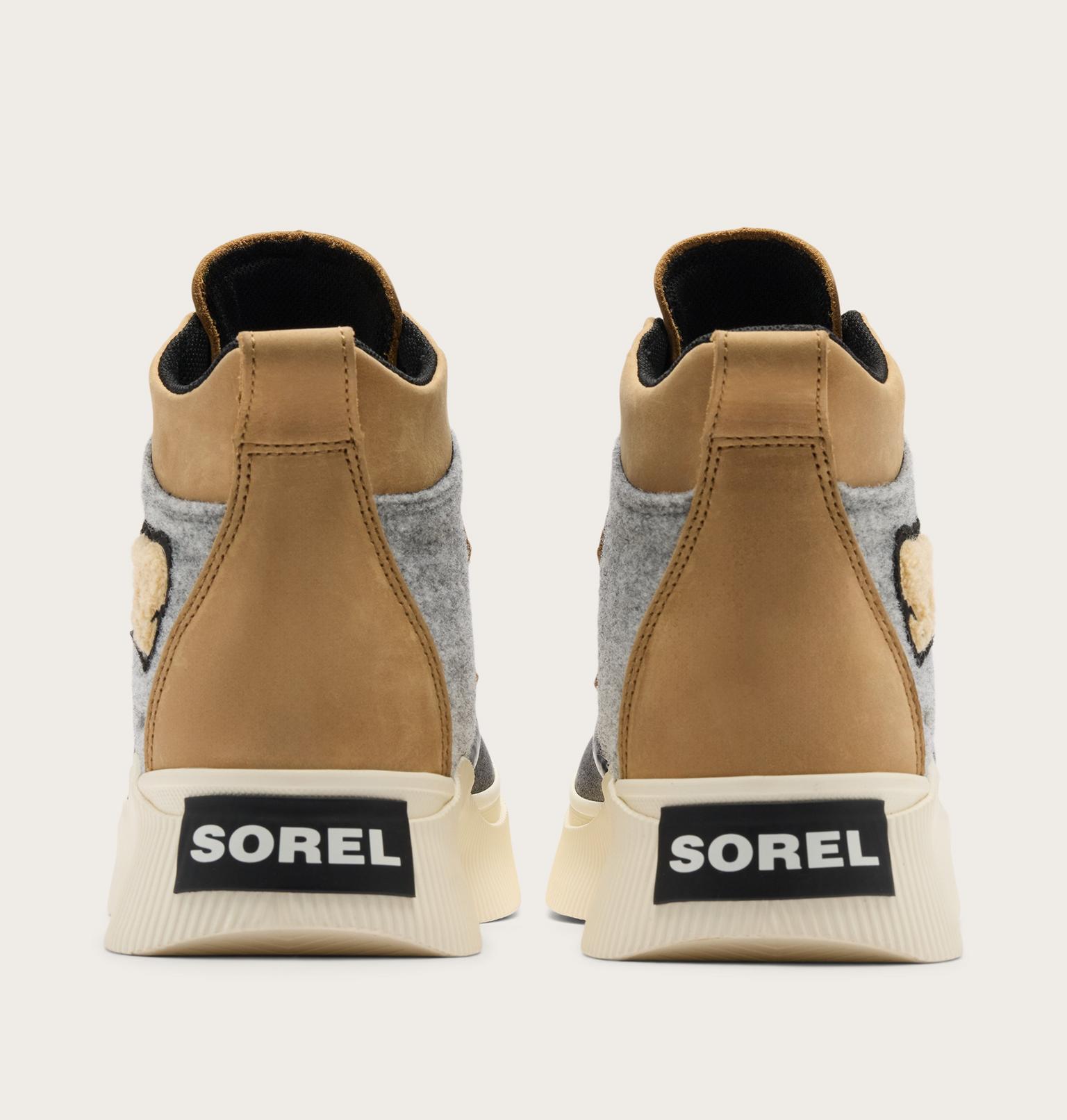 A pair of Sorel high-top sneakers shown from the back, featuring tan leather panels, a gray felt side panel, a beige sole with a black SOREL logo patch, and a small embroidered bear face on the heel.