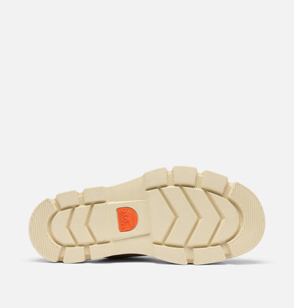 Close-up of a beige shoe sole with a red logo on a white background