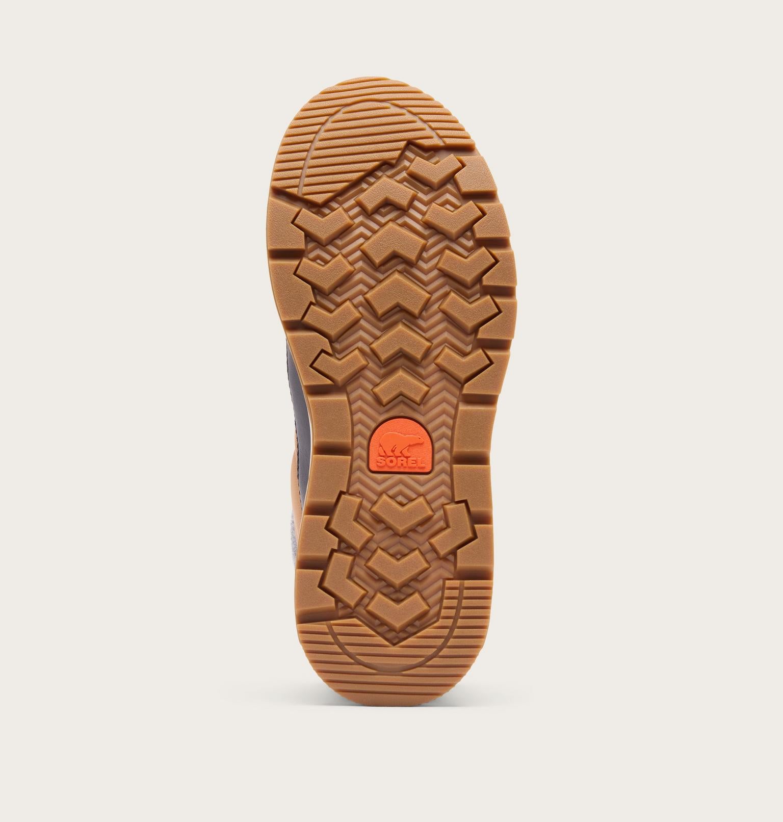 The outsole of a boot shown from a top-down view, featuring a textured brown rubber tread with a bright orange circular logo in the center, set against a light gray background.