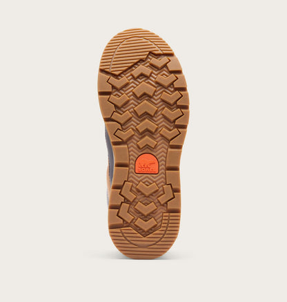 The outsole of a boot shown from a top-down view, featuring a textured brown rubber tread with a bright orange circular logo in the center, set against a light gray background.