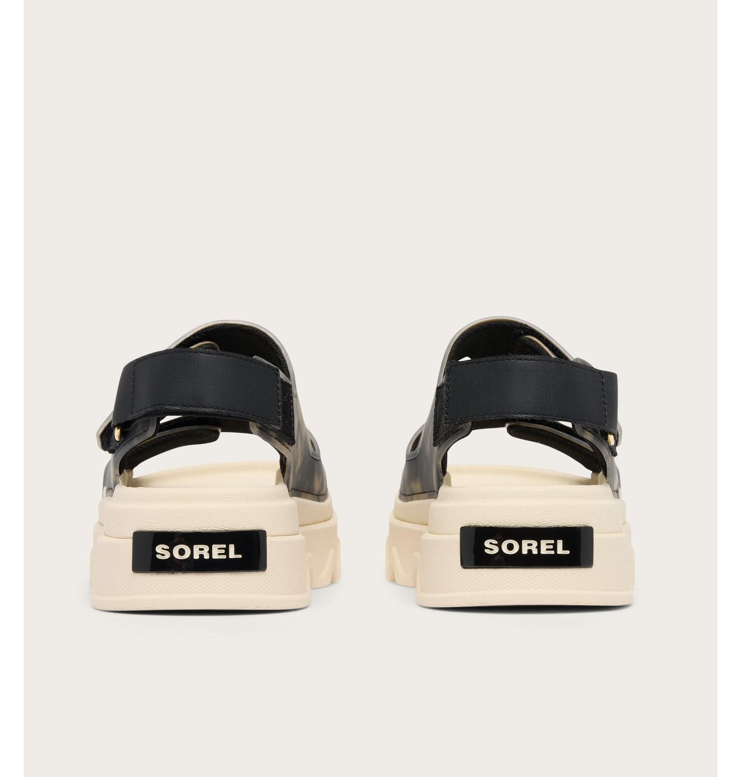 Pair of Sorel sandals on a light gray background