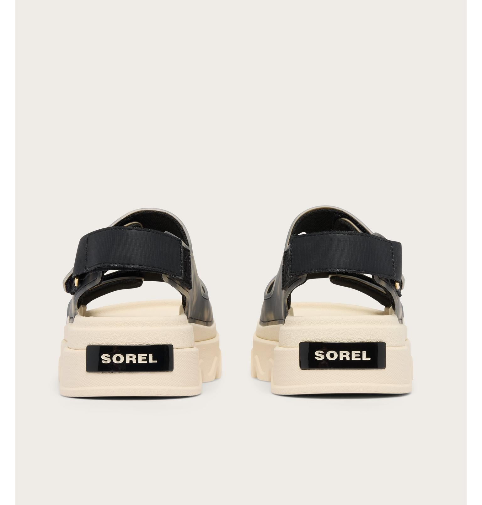 Pair of Sorel sandals on a light gray background