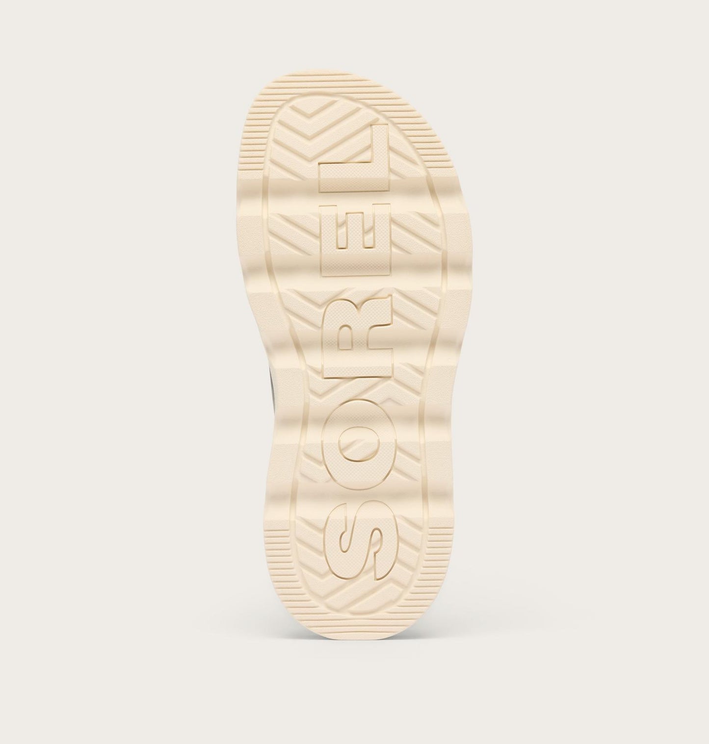Close-up of a beige shoe sole with brand logo on a light gray background