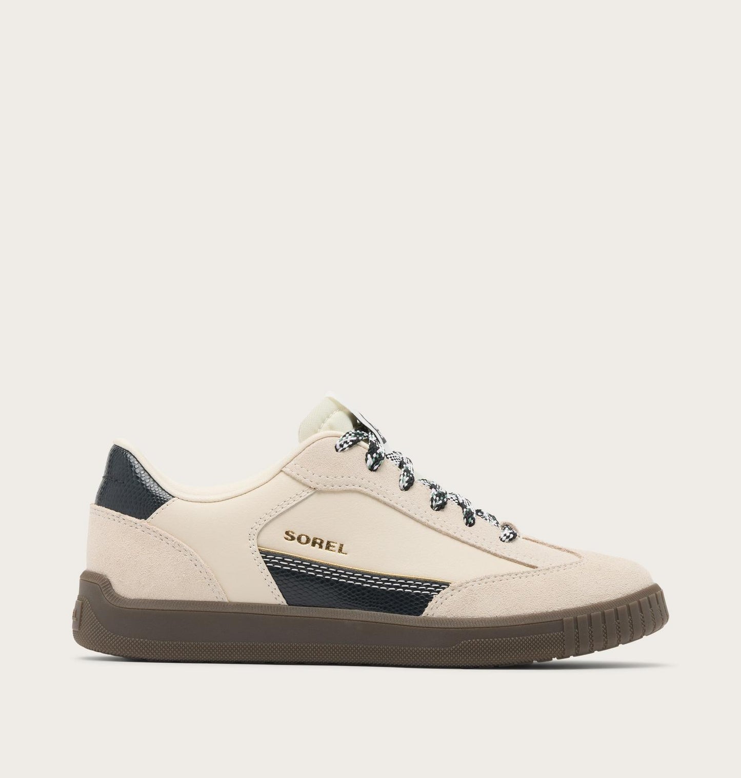 Beige sneaker with navy accents on a light gray background