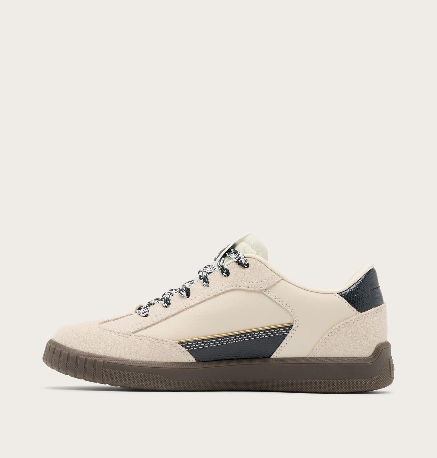 Beige sneaker with black accents on a white background