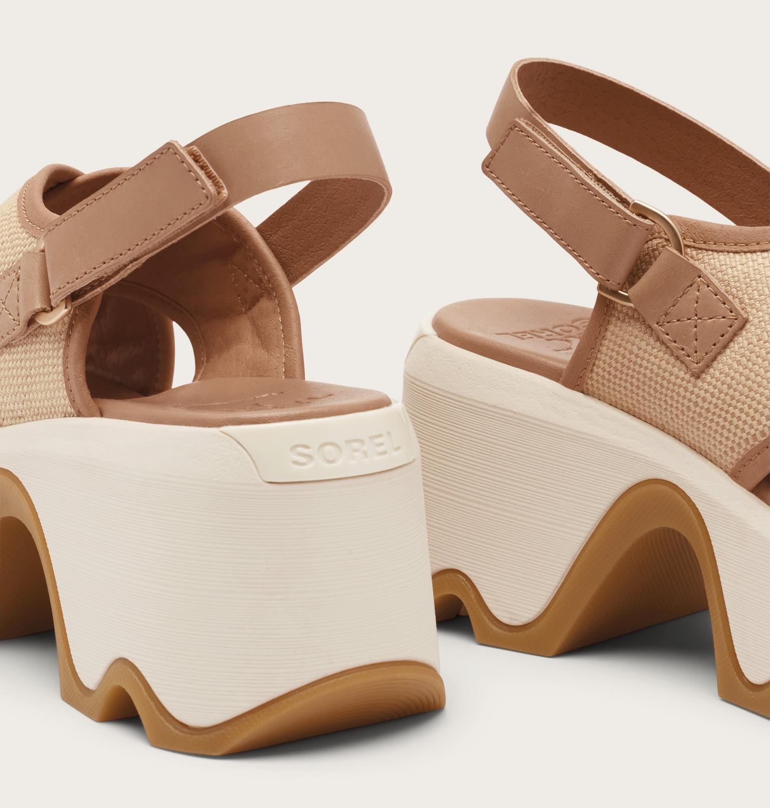 Brown and beige wedge sandals with 'Sorel' branding on a light background