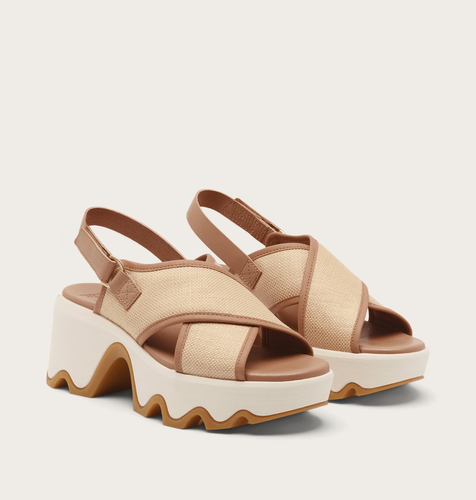 Beige sandals with a platform sole on a light beige background