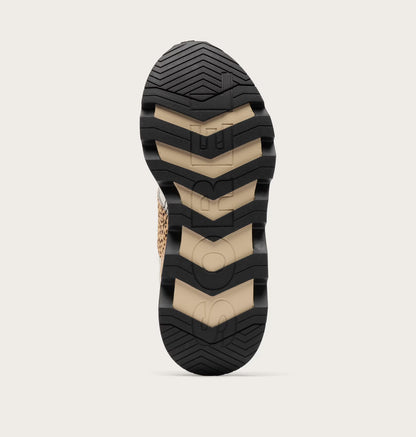 Close-up of a shoe sole with a textured pattern on a light gray background