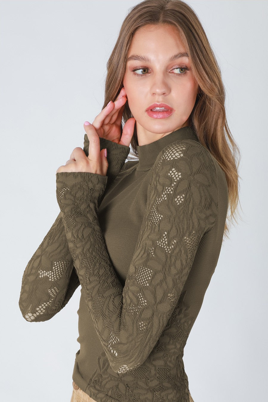 woman in long sleeve top 
