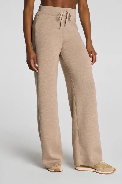 woman wearing tan lounge pants