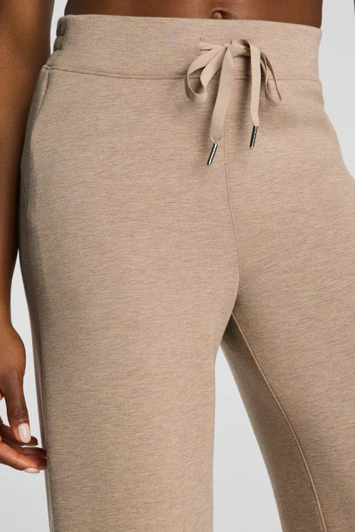 woman wearing tan lounge pants