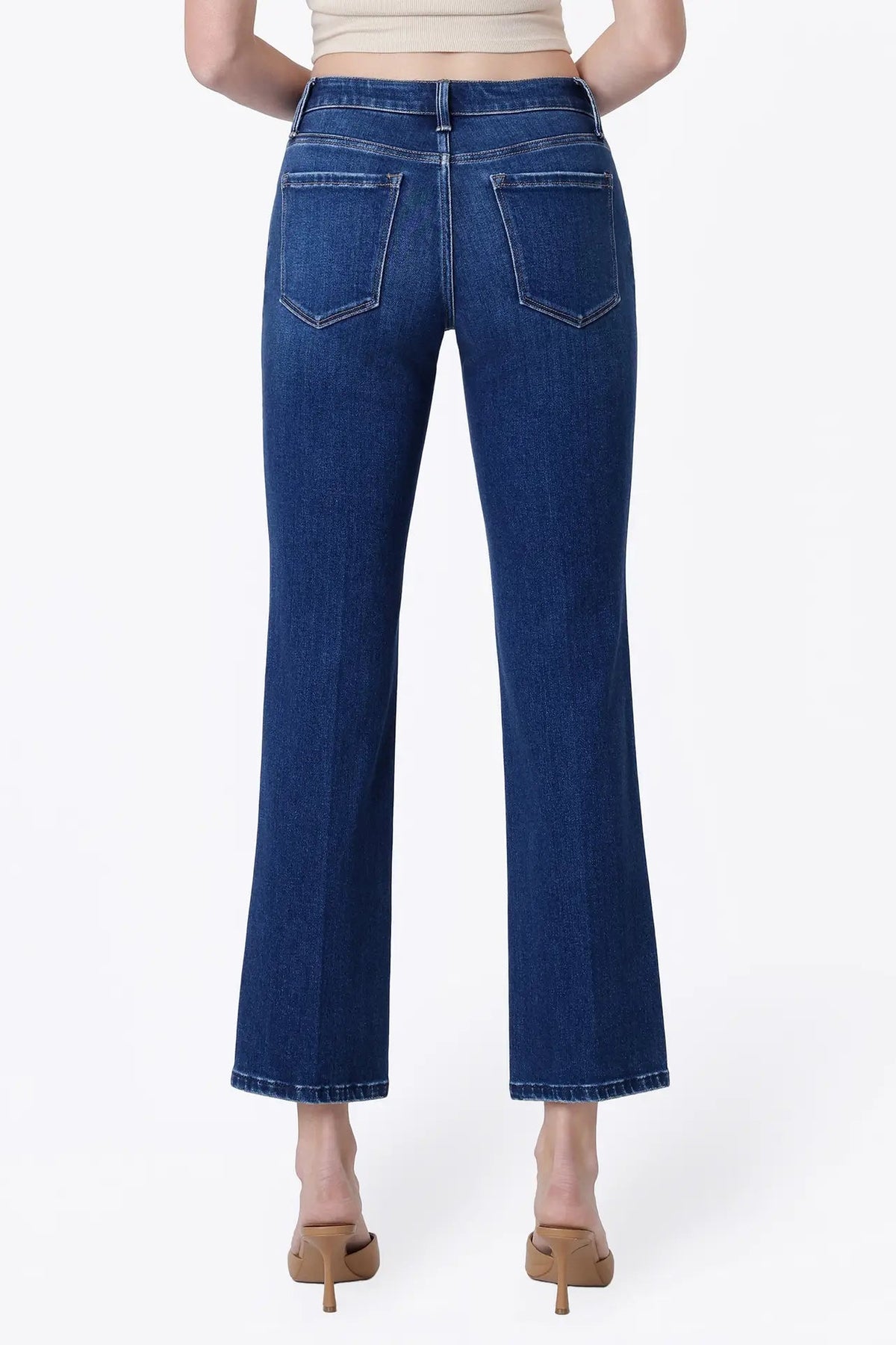 back view of person in dark wash jeans