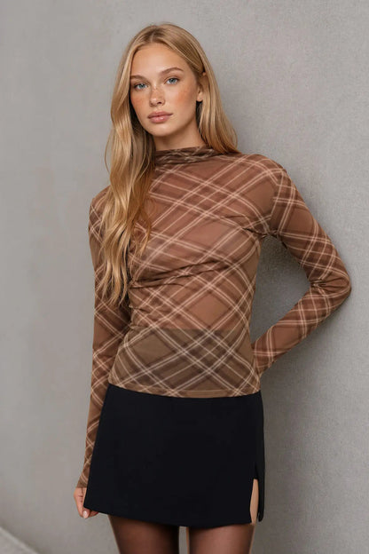 woman wearing plaid mesh top and skirt 