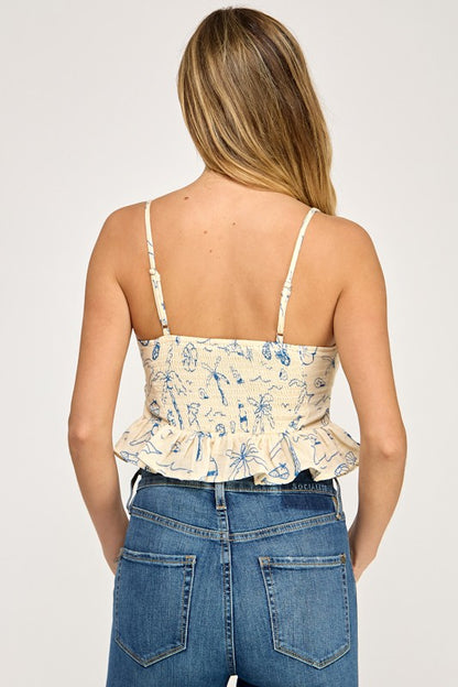 Woman wearing a floral top and blue jeans on a white background