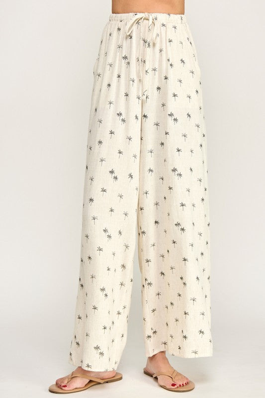 White pants with small black patterns on a white background