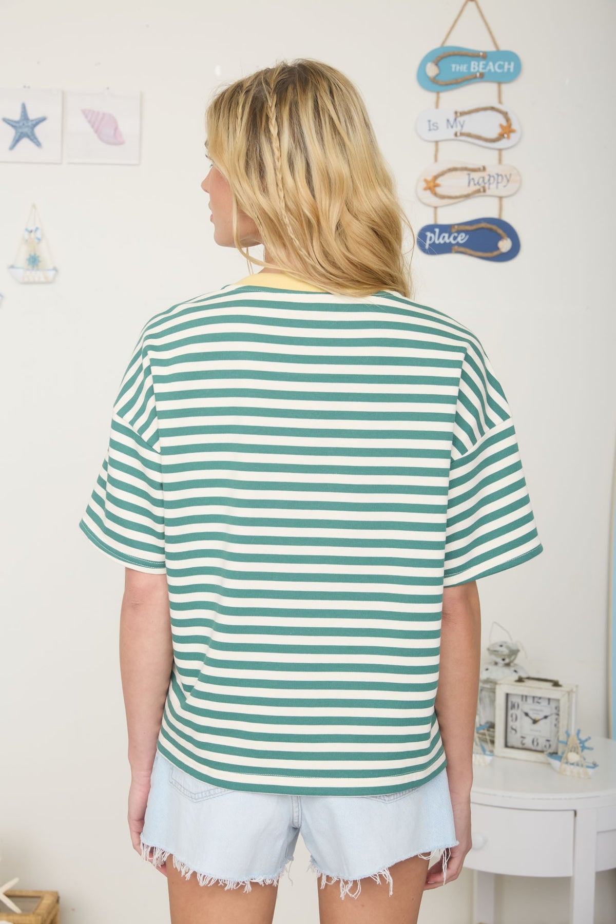 woman wearing green stripe tee