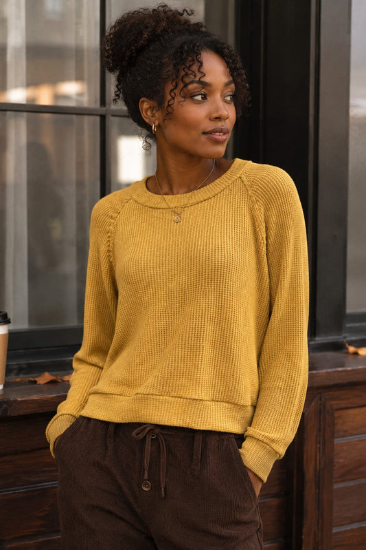 woman in long sleeve top