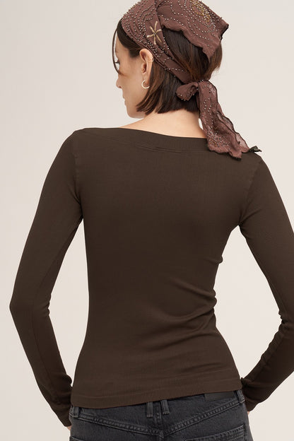 back view of woman in long sleeve top 