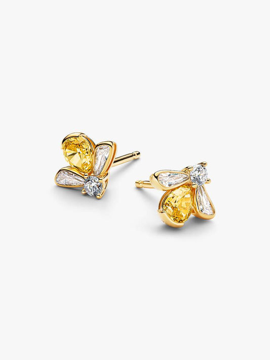 Gold butterfly earrings with yellow gemstones on a white background