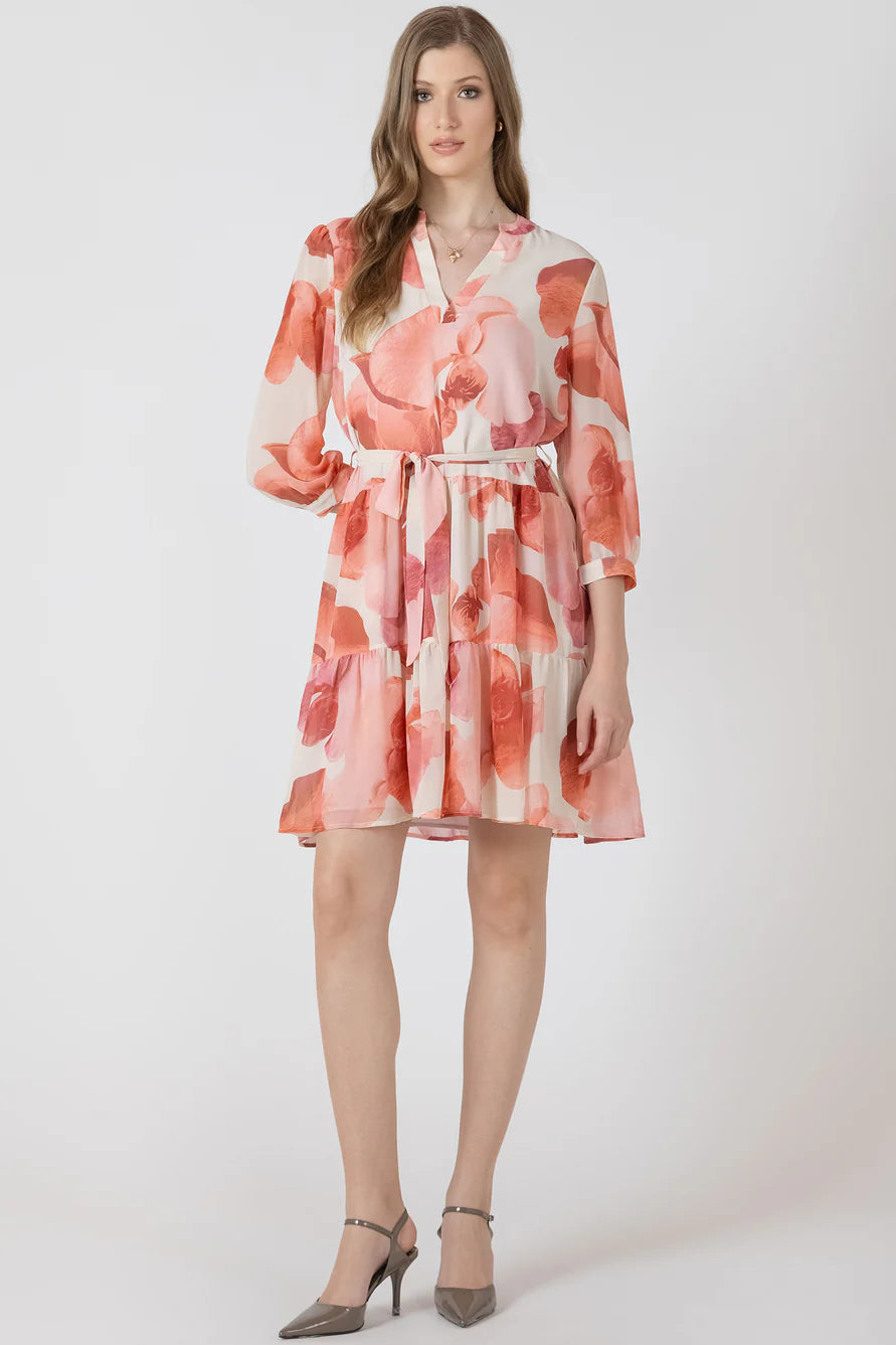 Woman wearing a floral dress on a white background