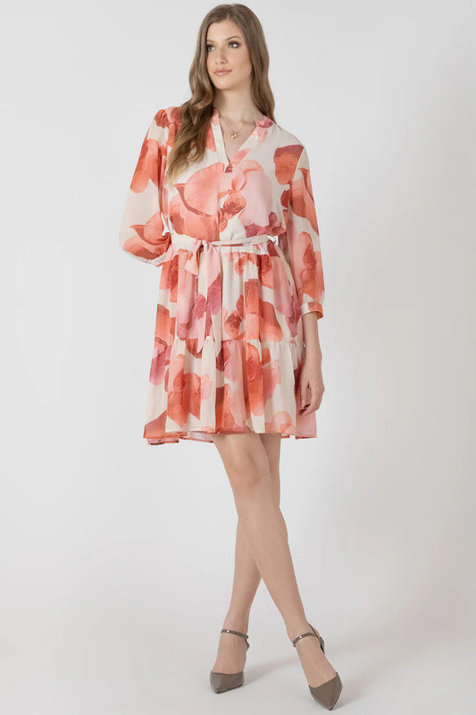 Woman wearing a floral dress on a white background