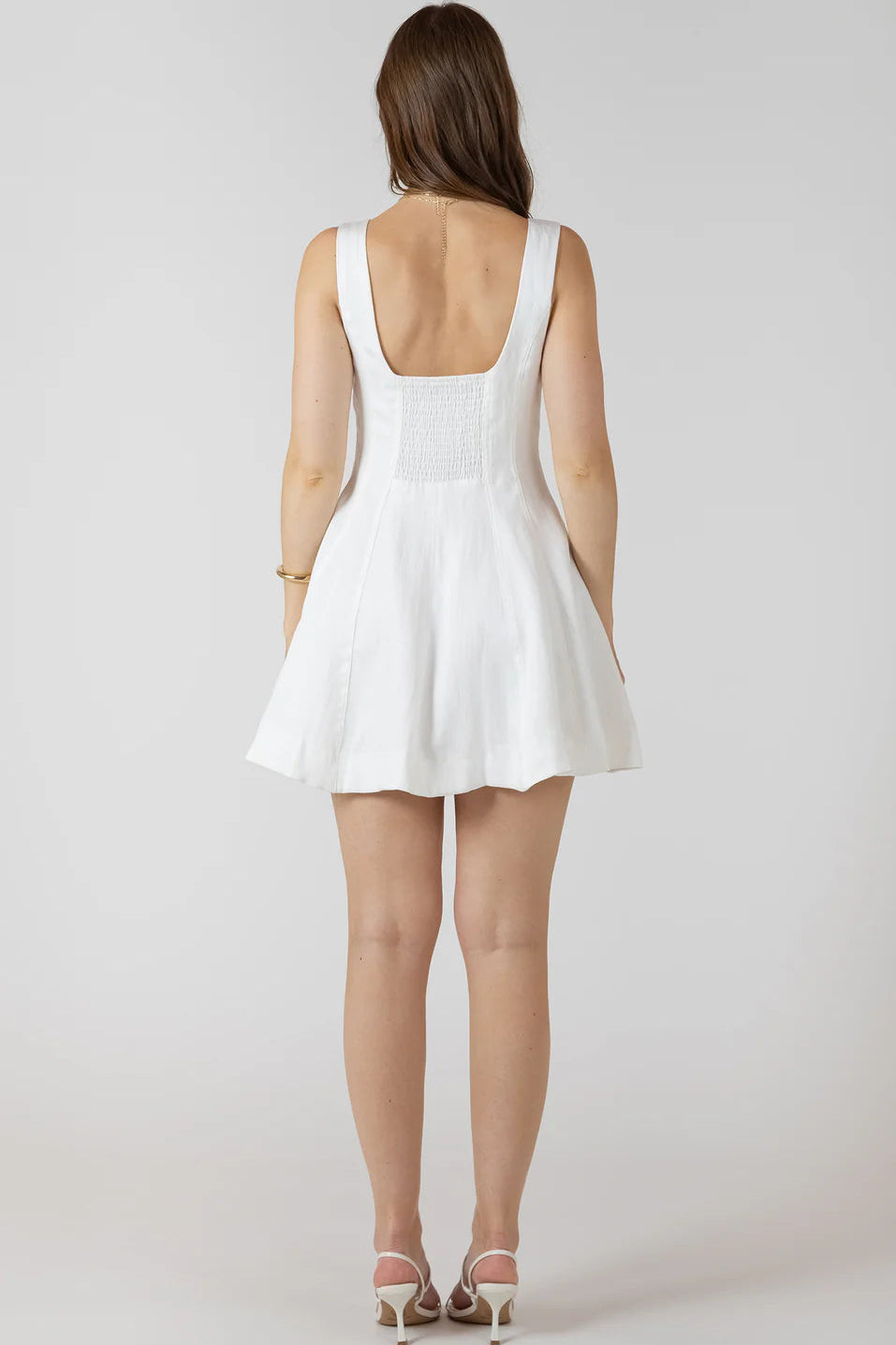 woman wearing white mini dress