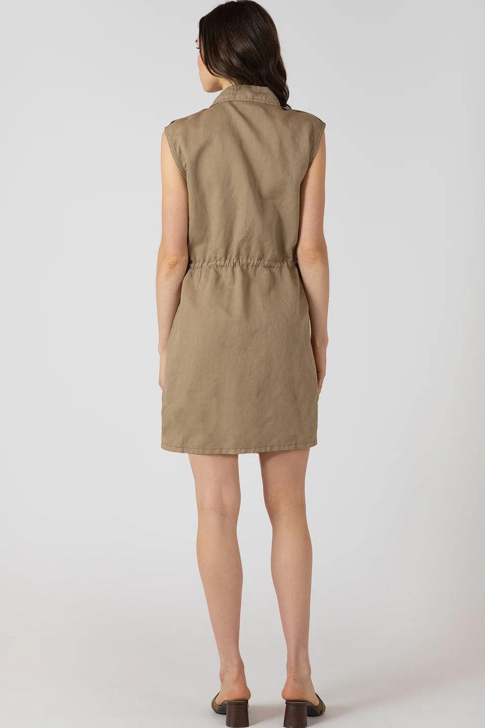 woman wearing tan utility dress