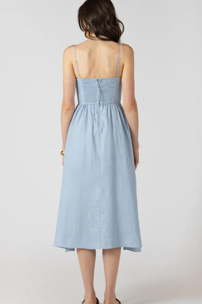 Light blue dress worn by a person on a white background