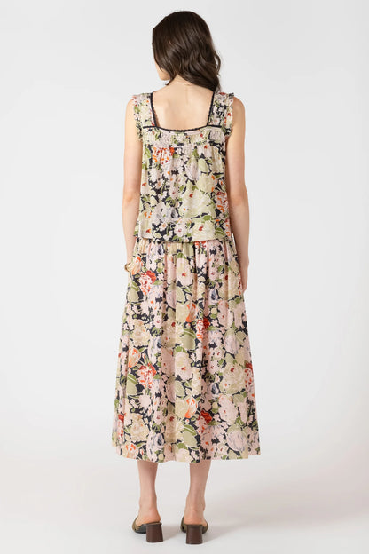 Woman wearing a floral dress on a white background