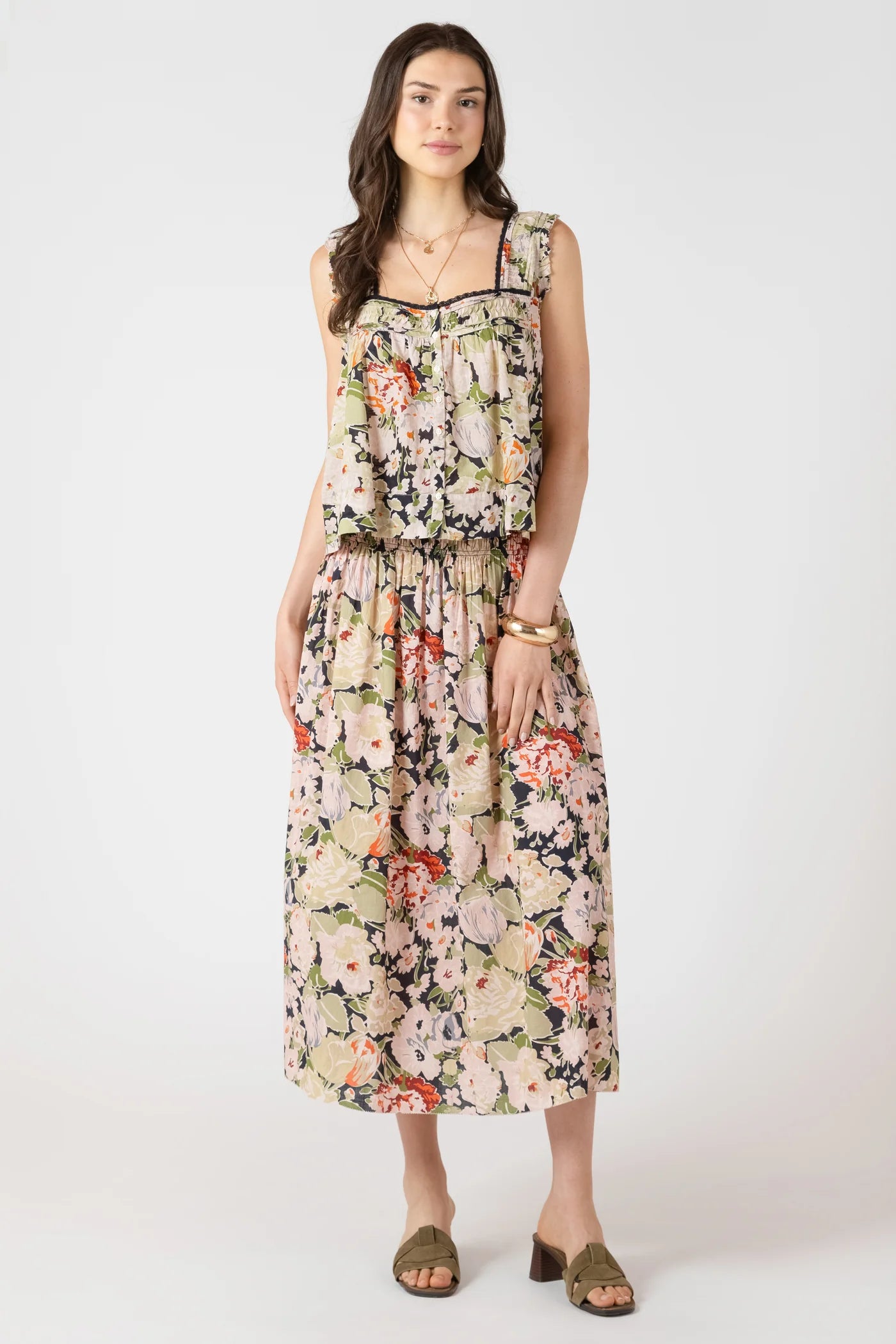 Woman wearing a floral dress on a white background