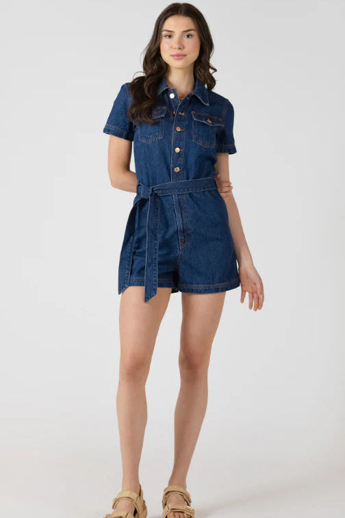 Woman wearing a denim dress on a white background