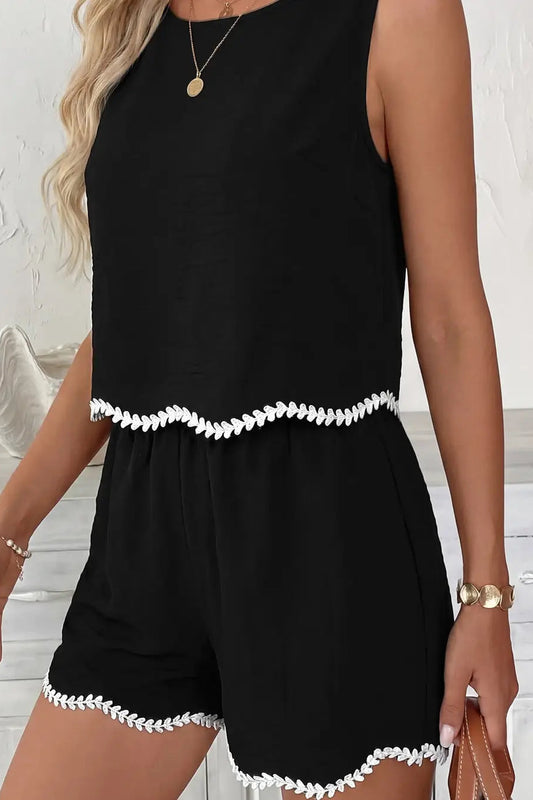 woman wearing black tank and shorts with white contrast