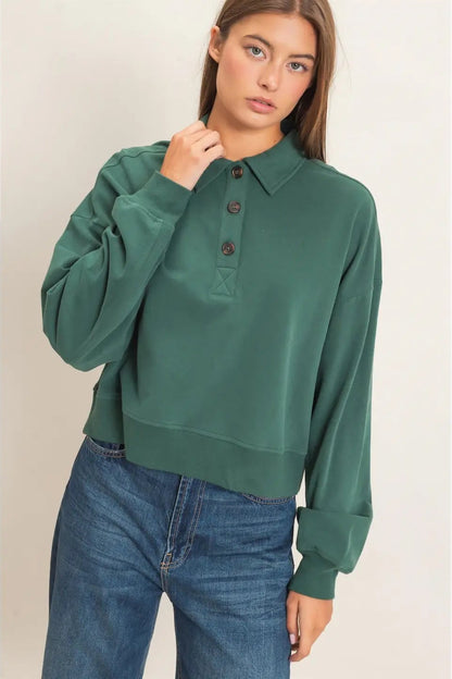 woman in button sweatshirt and jeans