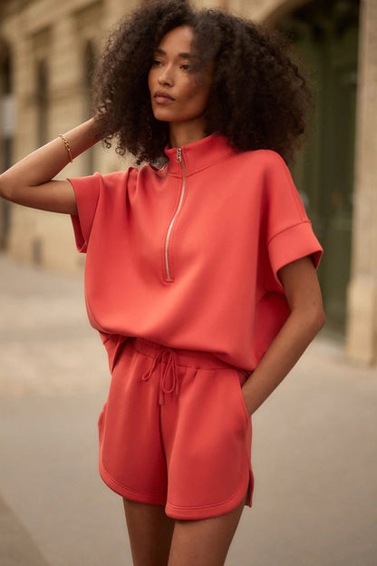 woman wearing red top and red shorts