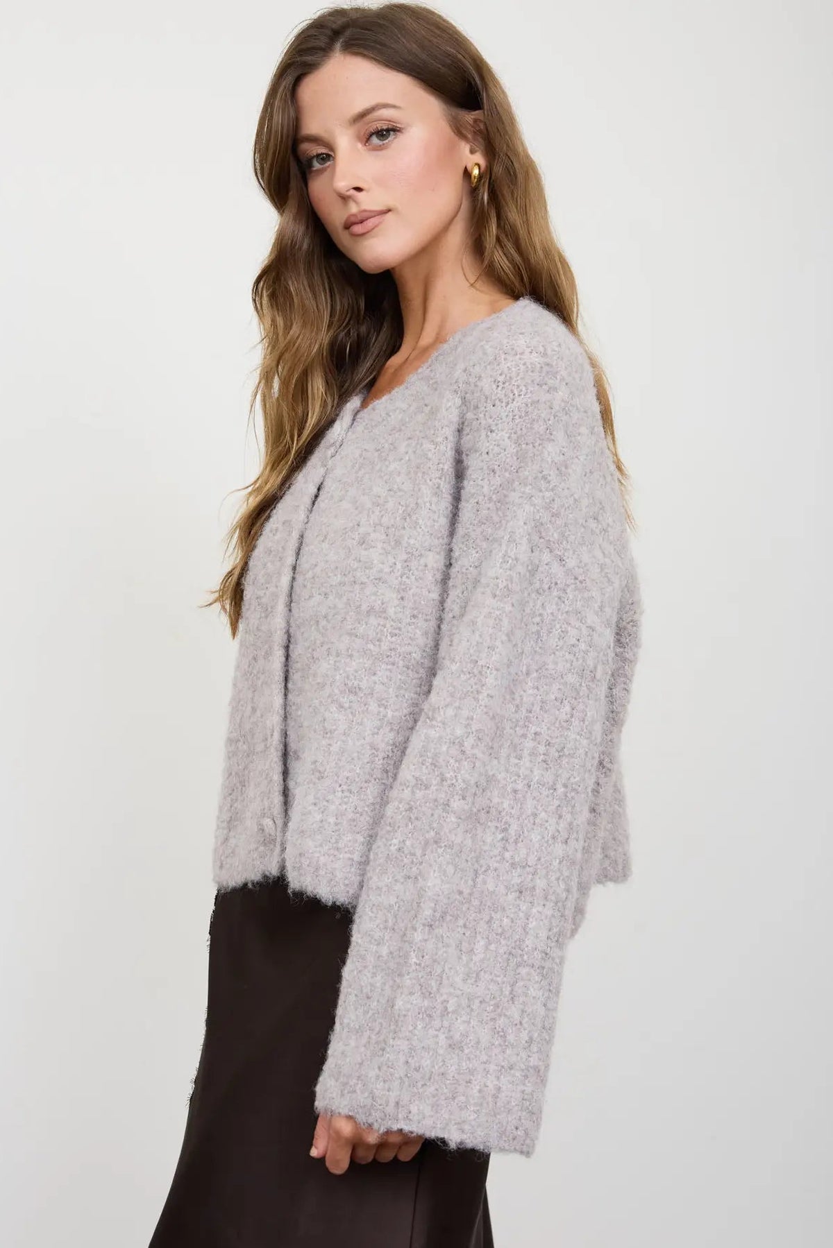 woman in fuzzy cardigan and skirt 