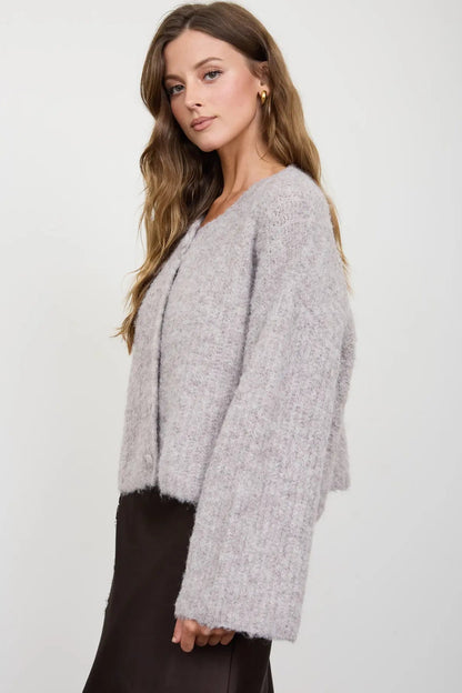 woman in fuzzy cardigan and skirt 