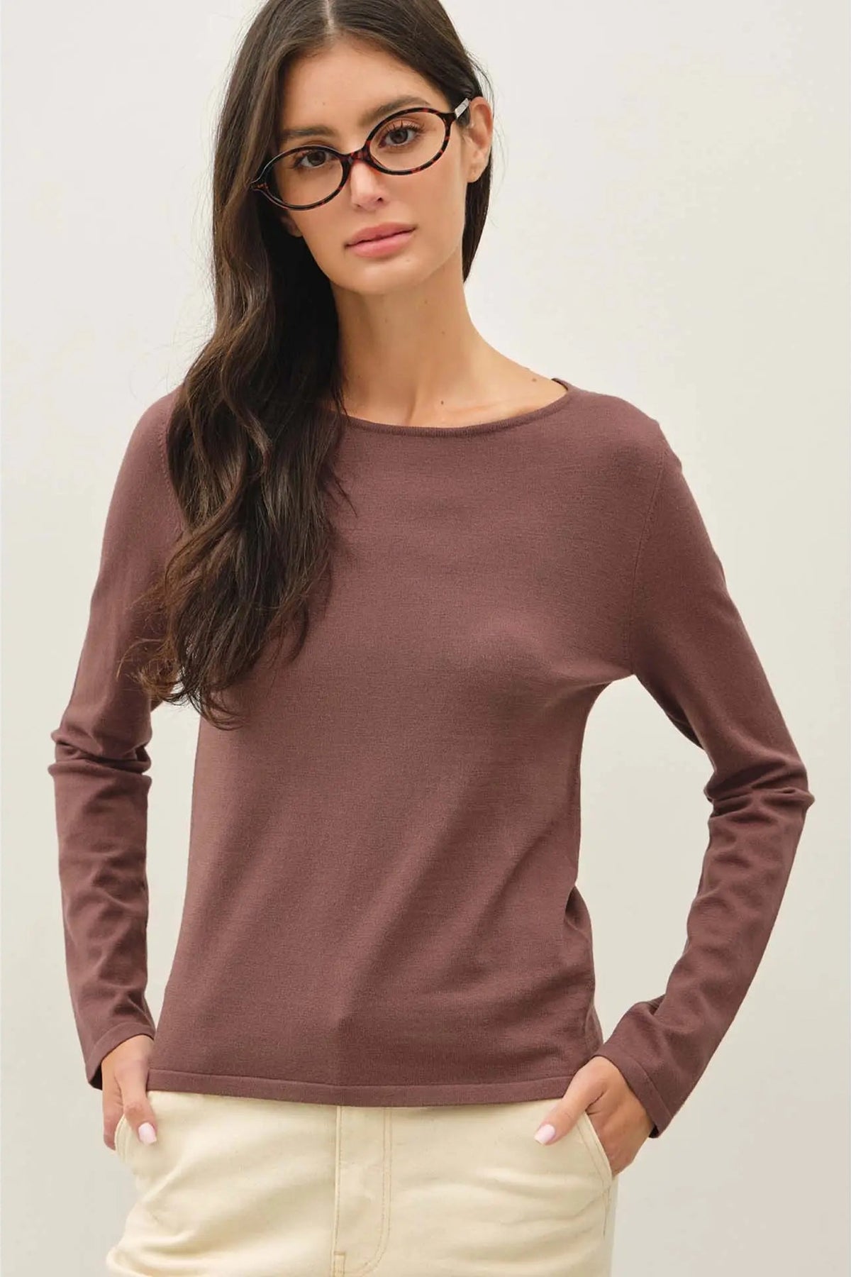 woman in long sleeve top