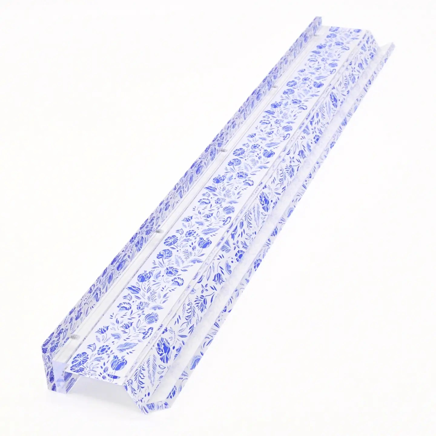 A long, narrow white channel-style product with an allover blue floral pattern, photographed on a plain white background.