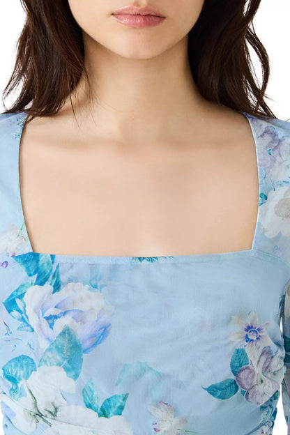 Light blue floral dress with a blurred background